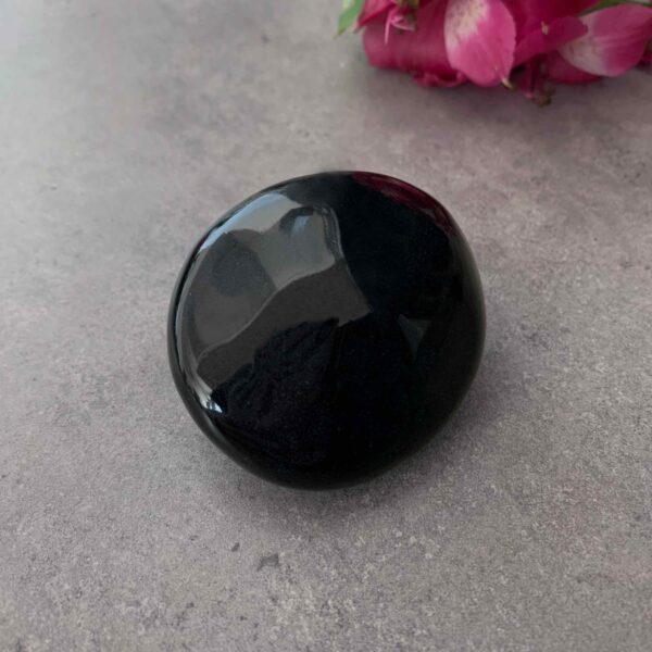 Reliquary in the shape of a round black pebble