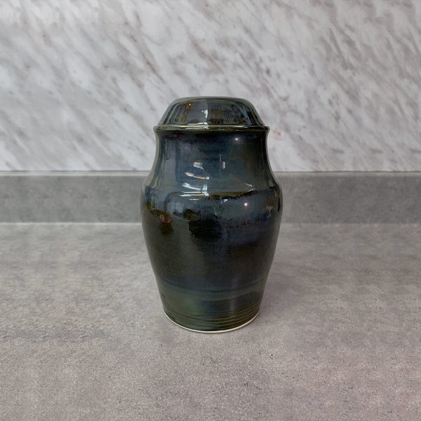 Reliquary in the shape of a small mirror elongated urn