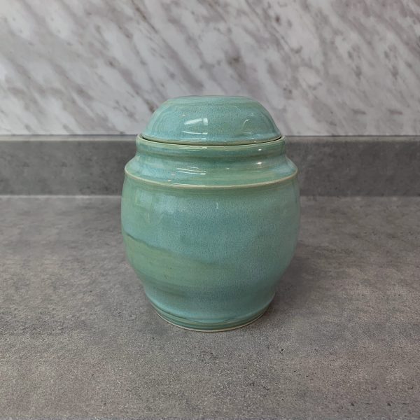 Reliquary in the shape of a small turquoise urn