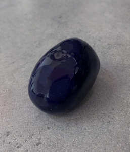 Reliquary in the shape of a royal blue oval pebble